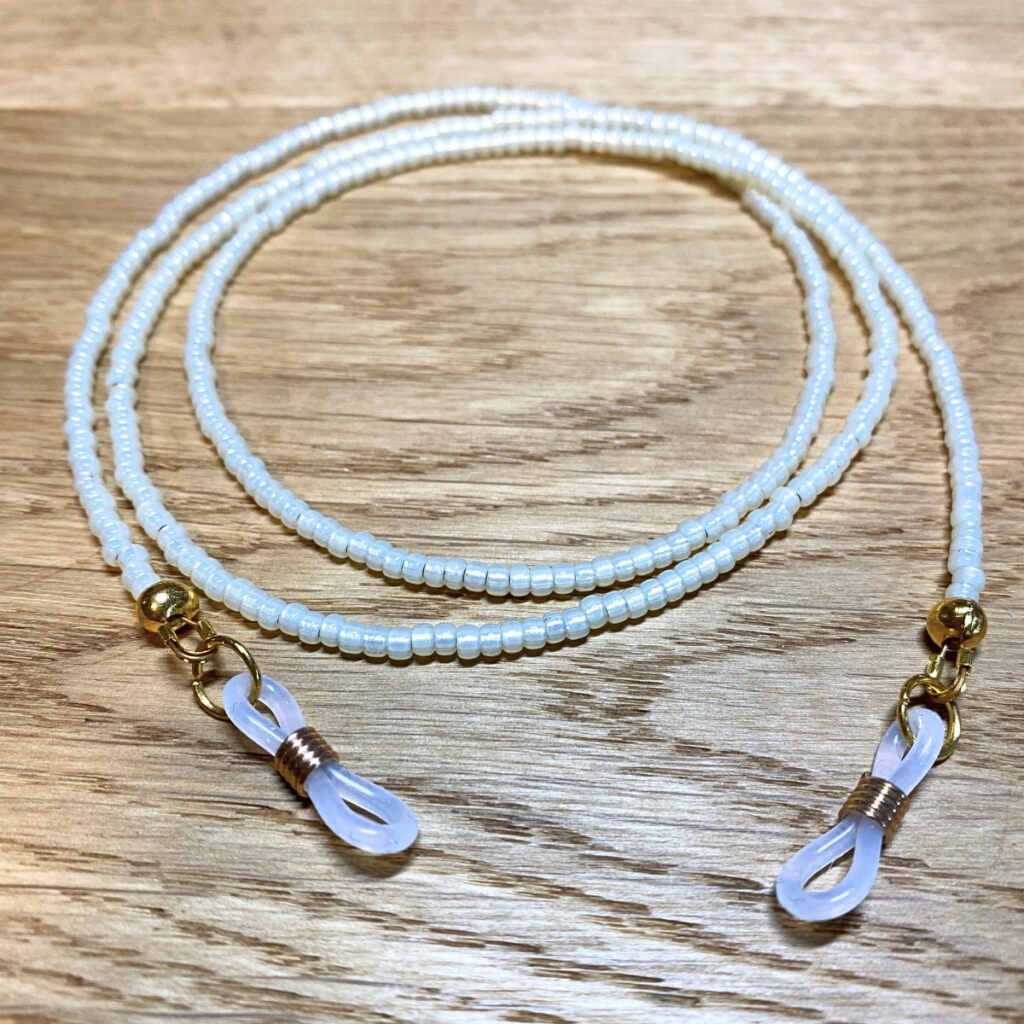 Brillenband in perlmut-gold